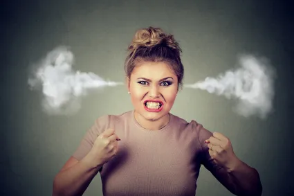 Photo of woman with illustration of steam coming out of her ears