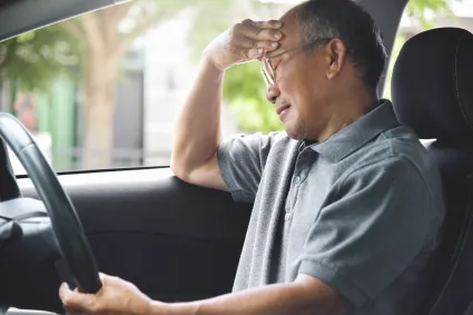 Man holding his hand to his head