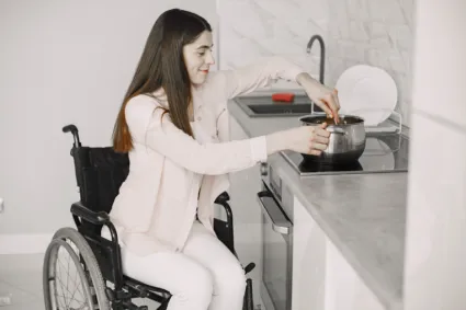 Woman in Wheelchair Cooking