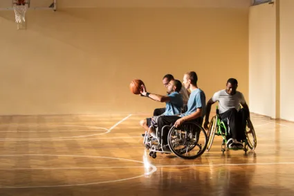 People in Wheelchairs Playing Basketball