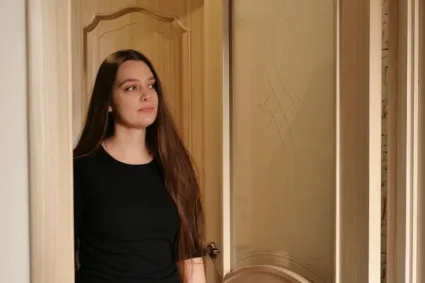 Person walking into a room