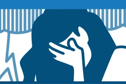 person holding their head in their hands