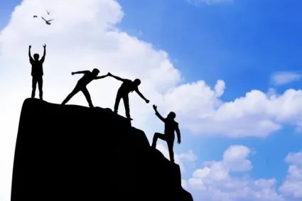 person overcoming mountain and standing on top