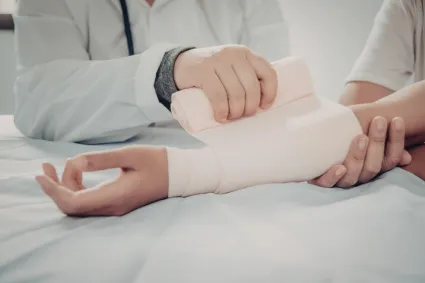 person getting arm wrapped