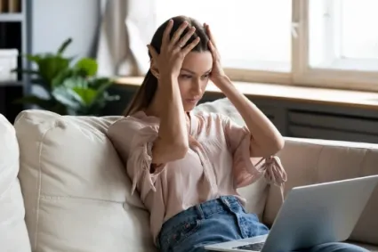 person stressed on laptop 