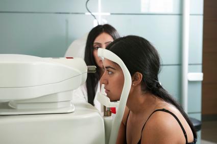 Photo of woman taking eye test