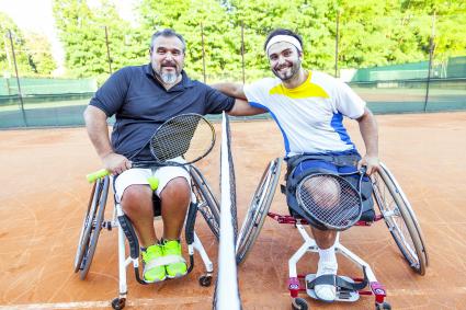 Men in wheelchairs after playing tennis