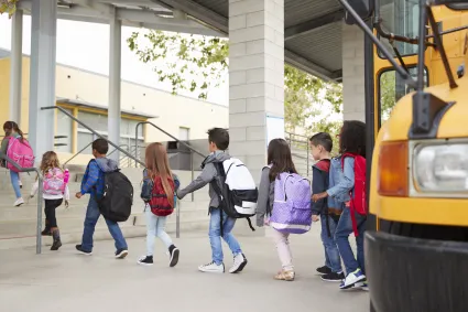 Photo of children exiting a school bus