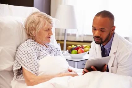Photo of clinician talking to woman with TBI