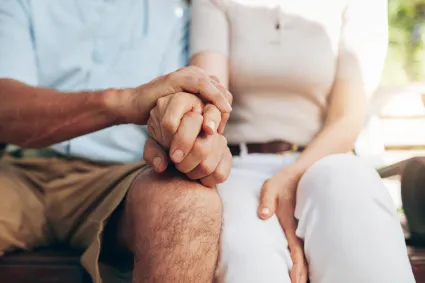 Photo of couple holding hands