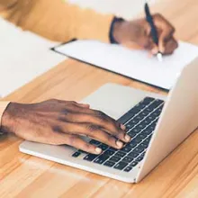 Person taking an online course on a laptop