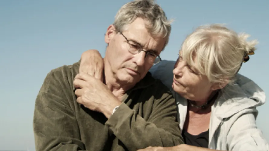 Older couple looking sad