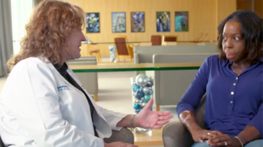 Clinician and patient talking.