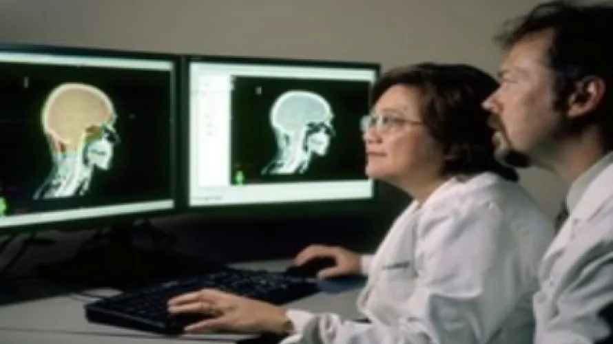 two doctors looking at the screen 
