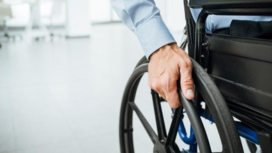close-up of hand on wheelchair