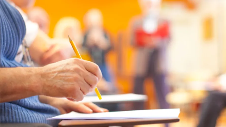 Student taking test at desk