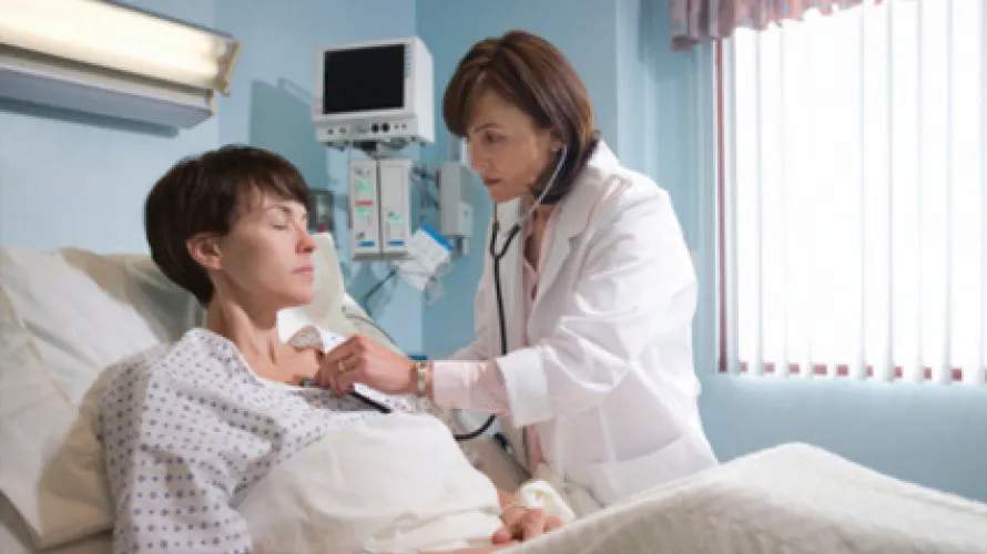 Doctor listening to a patient's lungs