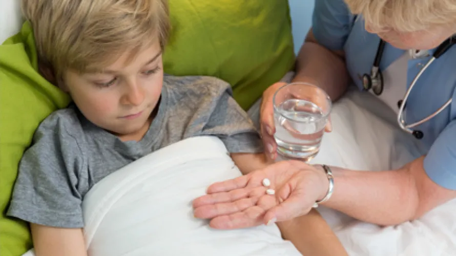 Child taking medicine