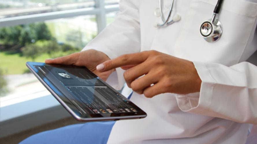 Doctor looking at information on tablet