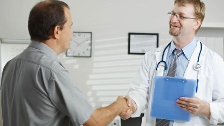 Patient and doctor shaking hands