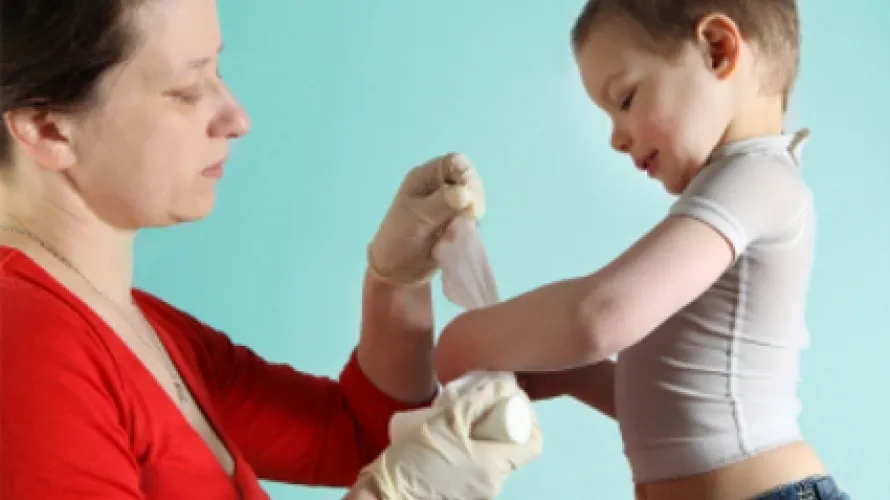Bandaging child's writsts