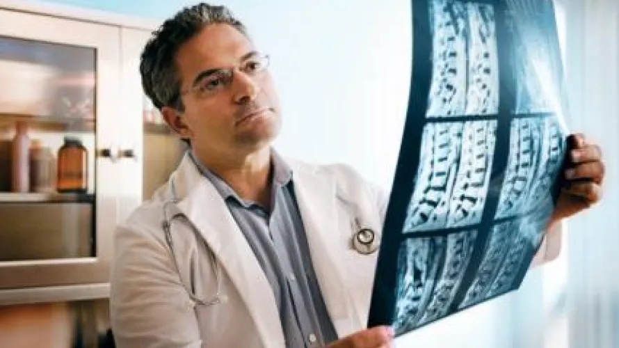 Doctor looking at x-ray