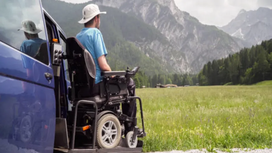 Man in wheelchair looking at mountains