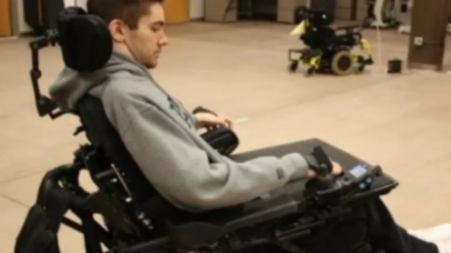 Man operating a power wheelchair