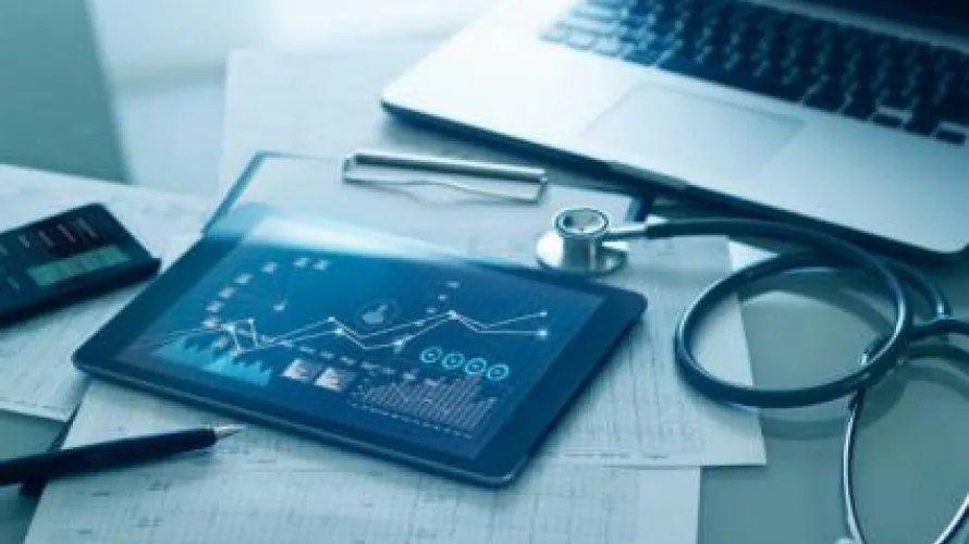 iPad with medical graphs on screen
