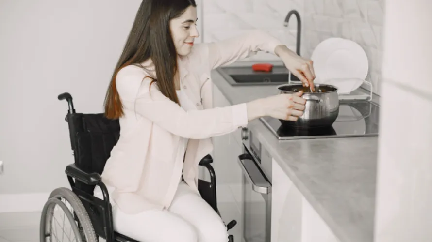 Woman in Wheelchair Cooking