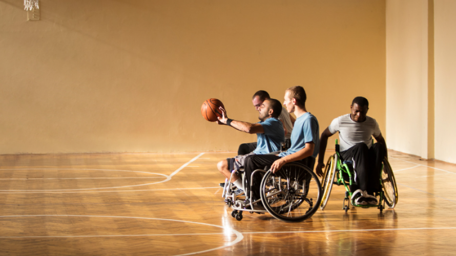 People in Wheelchairs Playing Basketball