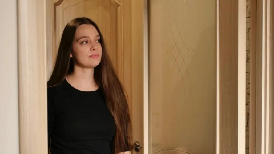 Person walking into a room